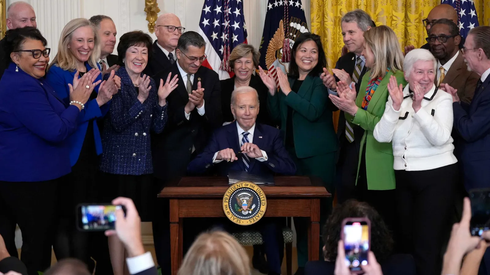 President Joe Biden signs the Social Security Fairness Act during a ceremony in the East Room of the White House, Sunday, Jan. 5, 2025, in Washington.