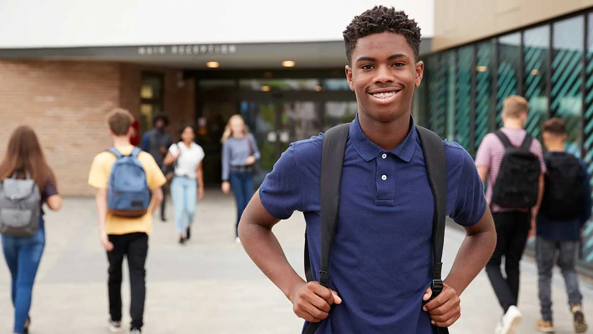 teen boy outside school