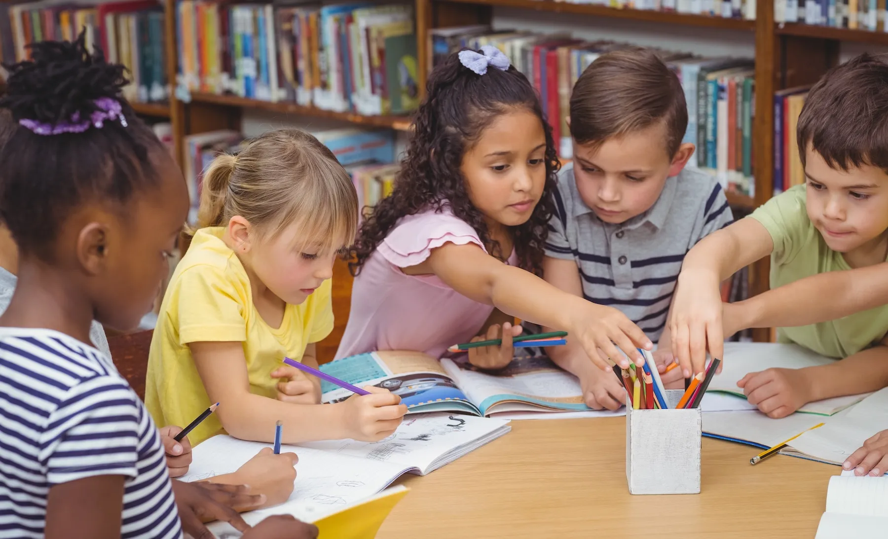 Young students around a table