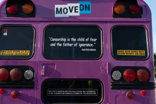 Photo of the back of the MoveOn Banned Books bus with a quote on the back window that says Censorship is the child of fear and father of ignorance