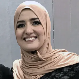 headshot of Rahaf Othman wearing a tan head scarf